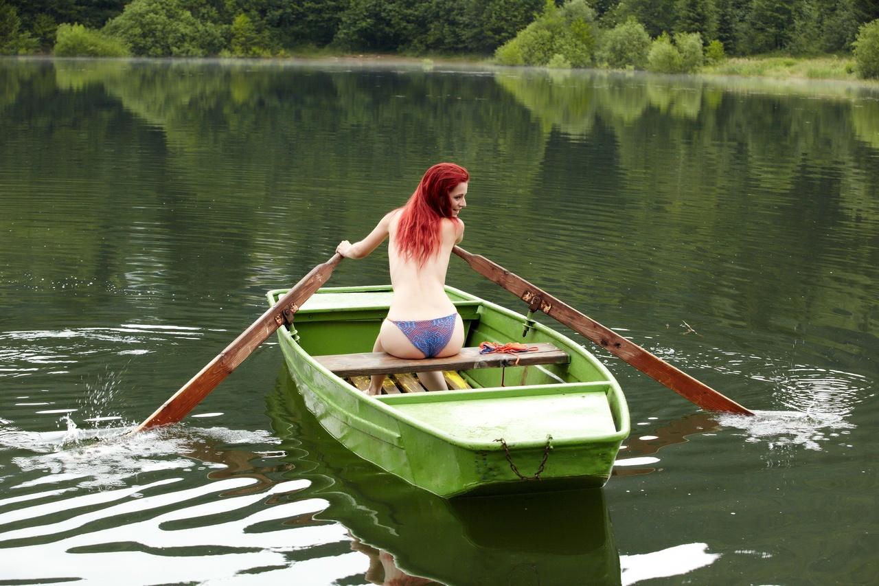 redhead in a boat