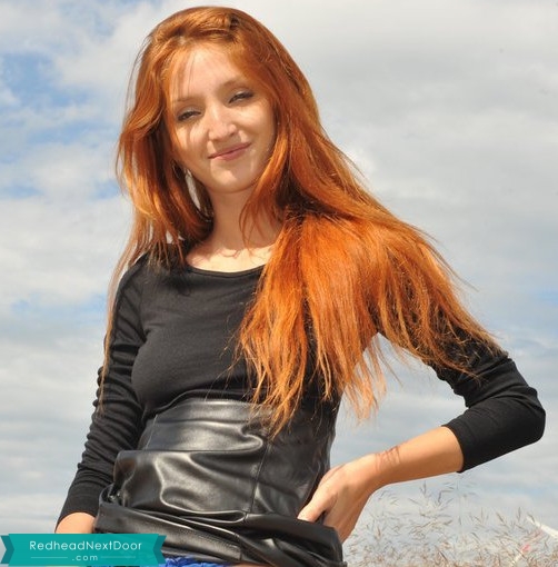 redhead with a pretty smile and hot body