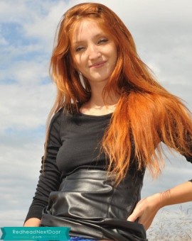 redhead with a pretty smile and hot body