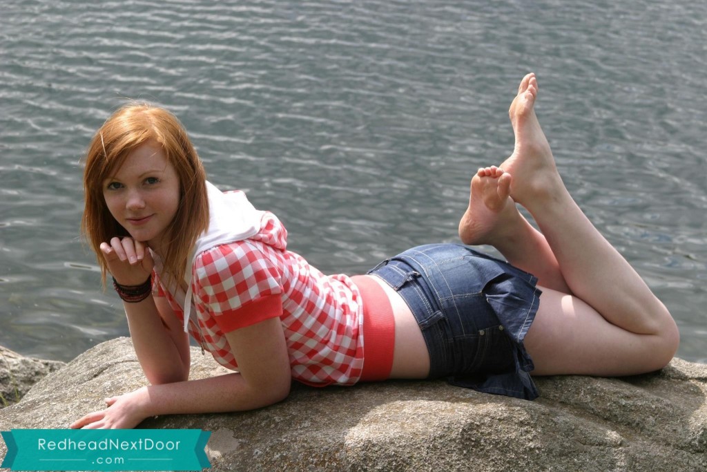 redhead on the shore